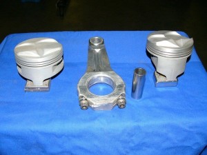 Here are examples of lightweight parts most all SB Pro Stocks ran. The piston on right is a classic narrow cylinder punishing but bigger HP slipper skirt. Piston on left is the stronger but heavier full skirt. The Brooks "Windage" rods were light and incredibly strong. In my 339 cid Cleveland, we spun those parts almost 12,000 rpms.