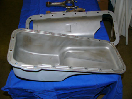this is an example of a ford fe pan with the infamous finned baffle. always reinforce the fin's welds. this should be used with windage tray pictured.