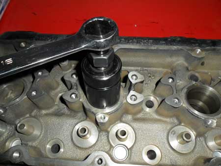 figure 3 - install the puller into the injector bore and using the bolt at the top, thread the puller into the injector sleeve.