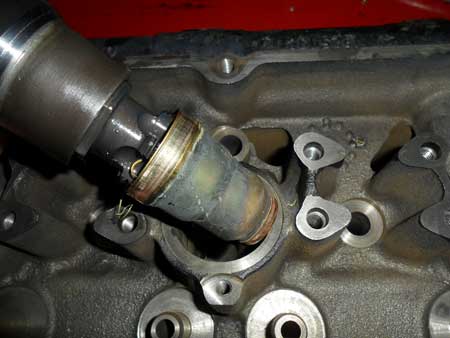 figure 4 - once the old sleeve is removed, you can see how the tool threaded into the injector cup. you can also see the condition the injector cup was in. remember in order to cool the injector, the bore is placed inside the coolant passage. the coolant is separated from the injector by the sleeve.