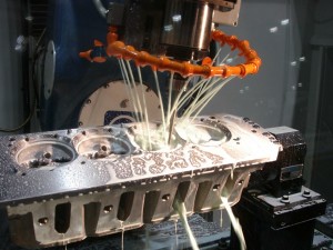 High speed CNC porting tooling requires plenty of coolant to flush away chips and to carry away heat.