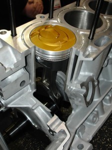 Top thermal barrier coatings are used on some gas direct injection engines to reflect heat.