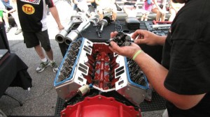 Head Games: Small block Chevy cylinder heads are installed during a COMP Cams Engine Builder Duel, as teams race against a clock in a performance engine building competition. Similar competitions are held at performance trade shows by seasoned engine builders, as well as youth, in competitions such as the Hot Rodders of Tomorrow.