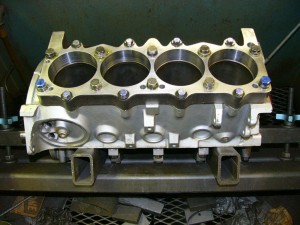 This is the rare R3 SB Mopar 18 hole block. It has 10 half-inch holes and 8 three-eighths inch holes per side. Since we couldn’t find a stud or bolt kit that worked, we had to get  creative for final fasteners. The Torque Plate was made for me by Rick Davis.
