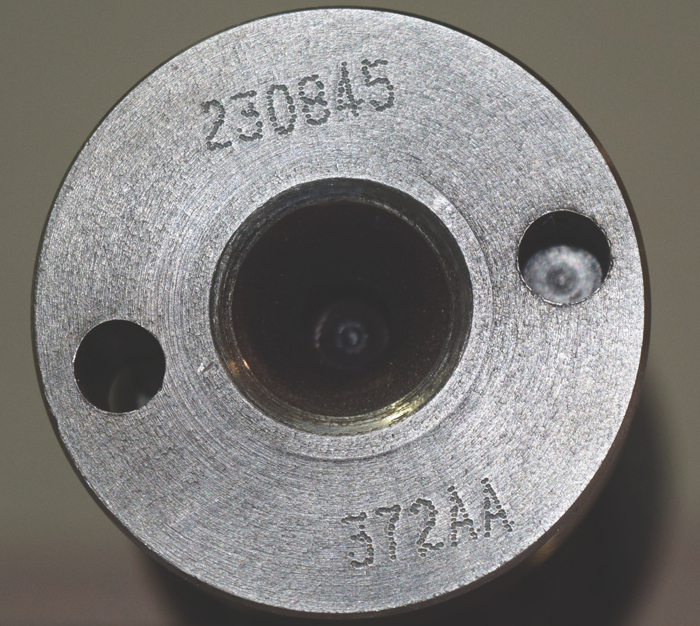 The last three digits of the part number and suffix are stamped in the back of the rear cam journal.