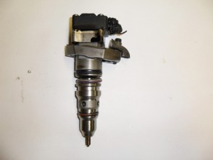 ABOVE: The injector for the 7.3L had a large body and was positioned above the valves with a solenoid on top for ­actuation (BELOW). 