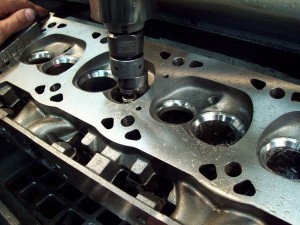 At this point we cut the valve seats with a multi-cutter to fit our larger valves.
