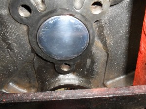 The rear cam plug is installed backwards compared to typical engines with the cup side facing outboard.