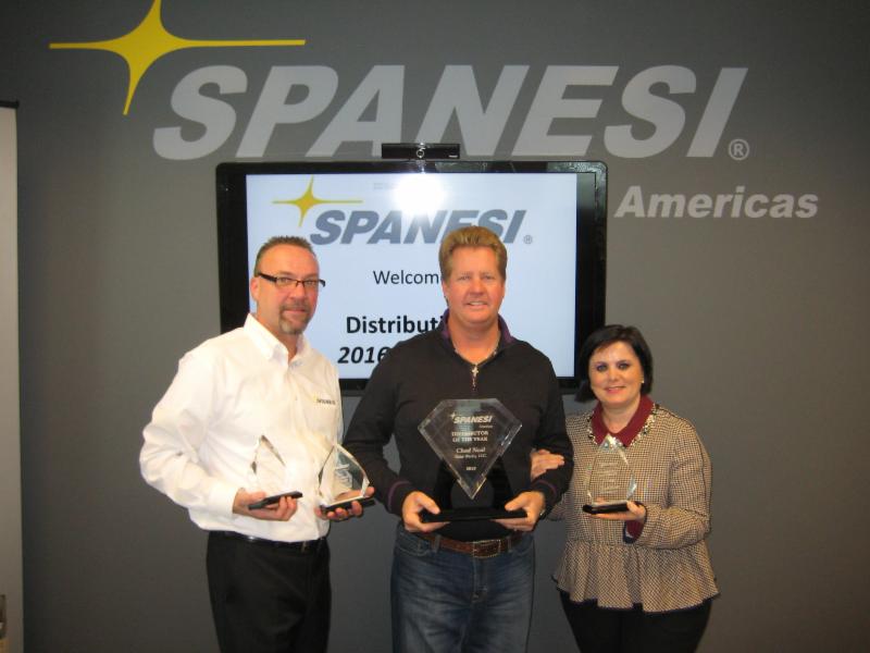 2015 Spanesi Americas Distributor of the Year Chad Neal (center) from Paint Works with Timothy Morgan and Cristina Spanesi