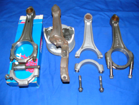left to right: low riser rod; broken low riser rod and piston from prior loose baffle incident; lemans rod; nascar rod.