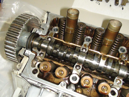The most common problem in OHC engines is worn and damaged cam journals in the cylinder head. In most late-model OHC engines, cam bearing inserts are not used. The camshaft usually runs directly on the machined bearing surface in the head. 