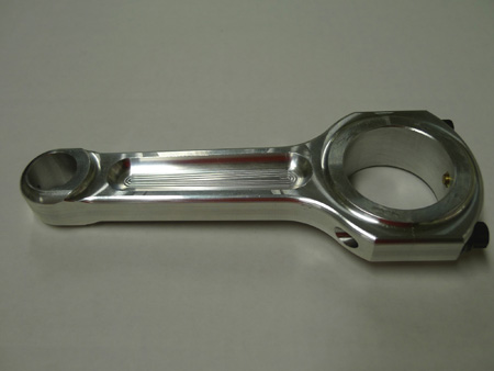 this is a custom made billet aluminum sport compact connecting rod from r&r racing products. drag racing applications often use aluminum rods for quicker acceleration and lighter weight.