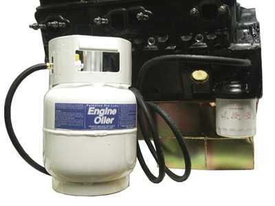 Use engine pre-lube tank to prime engine before initial startup.