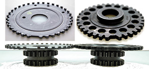 Figure 2 The timing gear on the left is stamped steel and is used with the tall gear set. On the right, is the PM wheel. The flange shown at top fits into the shorter gear stack, resulting in an identical height package.