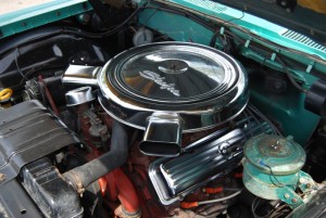 This car has a factory-issued chrome engine dress-up kit including valve covers, air cleaner and oil fill cap.