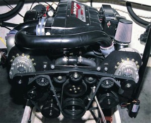 This is a Mercruiser 502 magnum engine, which has had a pair of axial  superchargers mounted on it. A very common engine and a representation of a fairly typical bolt-on mod.