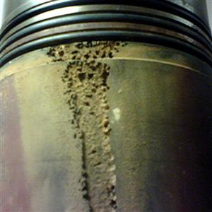 A diesel cylinder liner showing the effects of cavitation erosion.