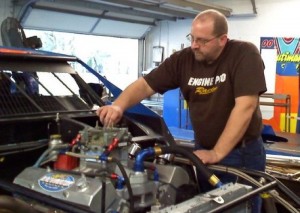 Kevin Frische preps a race engine at his shop in  Wapokaneta, OH.